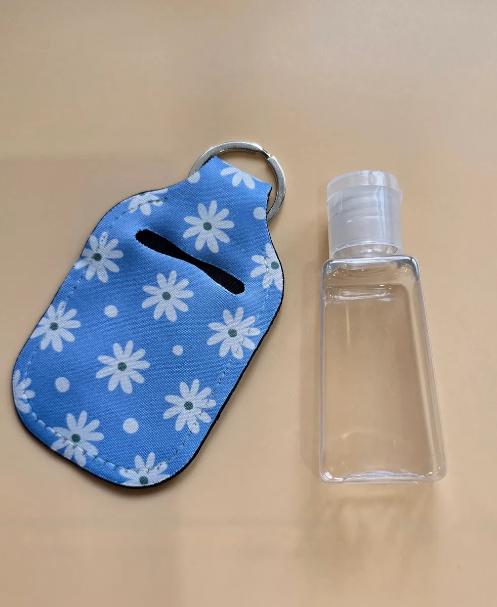 Key chain hand sanitizer holder with refillable bottle