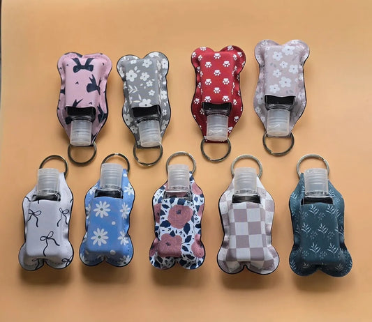 Key chain hand sanitizer holder with refillable bottle