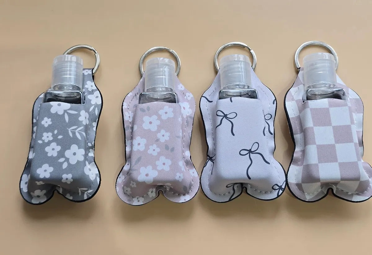 Key chain hand sanitizer holder with refillable bottle